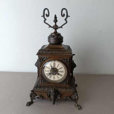 a small clock that is sitting on a table