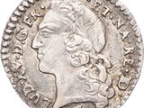 une pièce d'argent portant une tête de femme et une couronne