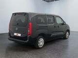 the black van is parked in the empty room of the building