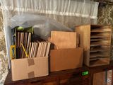 many boxes on a table with a window in the background