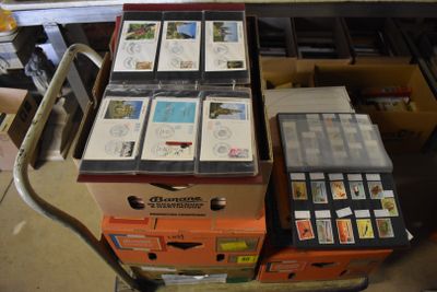 many boxes of stamps on a cart in a room