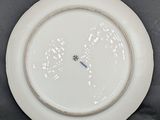 a white plate with a blue and white design on it