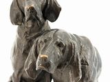 a statue of two dogs sitting on top of each other