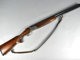 the rifle is laying on the table ready to be used