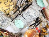 a close up of a bunch of jewelry on a table