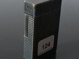 an image of a lighter that is on a table