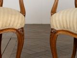 pair of 19th century french carved walnut armchairs with upholstered upholstered arms