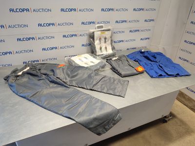 a blue jacket and pants sitting on a table in a room