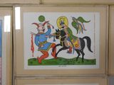 two framed pictures of a man riding a horse and a woman riding a horse