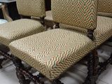 four chairs that are sitting on a tile floor
