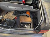 a trunk of a car with a bunch of items in it