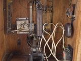 a wooden box with a machine inside of it
