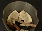 a small bowl with a wooden spoon inside of it