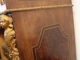 a wooden table with a mirror on top of it
