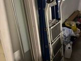 a ladder that is next to a window in a room