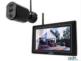 a close up of a camera and a monitor on a wall