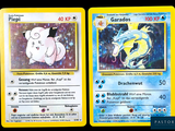 two pokemon cards with a picture of two different pokemons on them