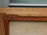 a picture of a picture of a window with wood trim