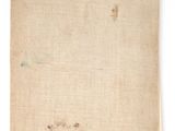 a close up of a piece of paper with a tag on it