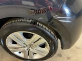 a close up of a car ' s tire with a sticker on it