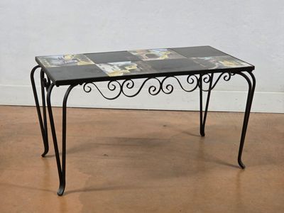 a small table with a glass top on a wooden floor