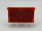 a close up of an orange plastic box on a white surface