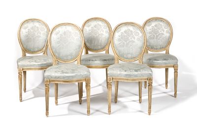 four chairs with upholstered upholstered seats and a gold frame