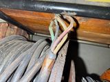 a close up of a bunch of wires and wires on a shelf