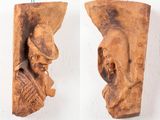 pair of carved wood wall sconces of a man and a woman