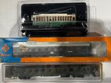 three toy trains sitting on top of each other on a table