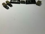 lego army vehicles are lined up on a white surface
