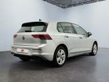 the rear end of a white volkswagen e - golf parked in a garage