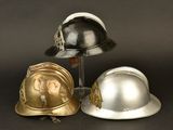 three helmets sitting next to each other on a table