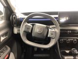 the interior of a car with a steering wheel and dashboard controls