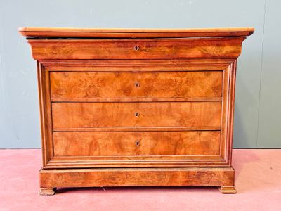 an antique chest of drawers on a pink carpeted floor