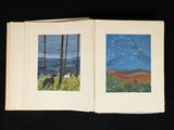 an open book with two pictures of animals in a field