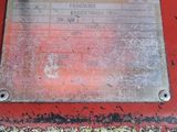 a picture of a metal plate on a red table