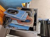 a pile of clamps sitting on top of a blue box