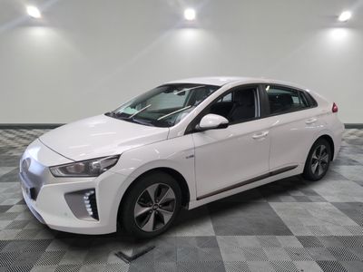 the white car is parked on a checkered floor in the garage