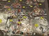 a table with a lot of stamps and postcards on it