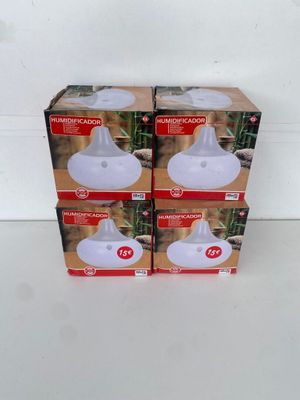 three boxes of air freshener sitting on top of a white table