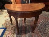 a wooden table with a wooden top on a rug