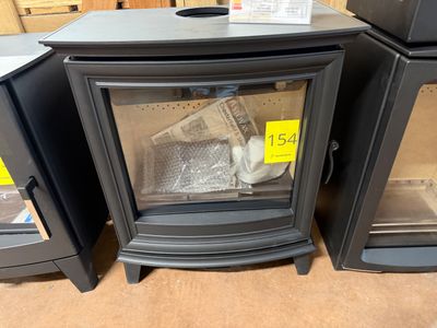 three stoves that are on display in a store