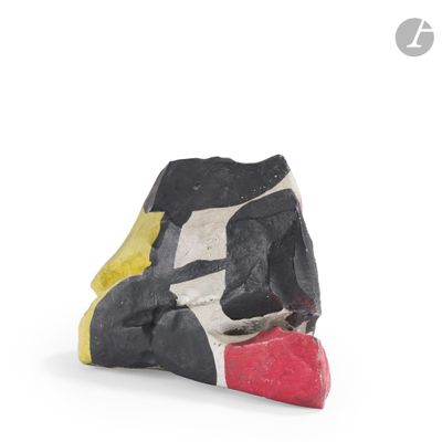 a black, white, and yellow sculpture of a dog