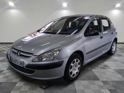 a picture of a silver car parked in a garage