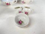 four cups and saucers sitting on a table