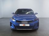 the front view of a blue car in a showroom