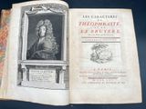 an open book with a picture of a man in a wig on it
