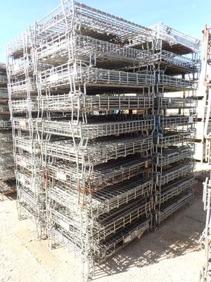 a large pile of cages that are stacked on top of each other