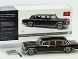 a black model of a car in a box